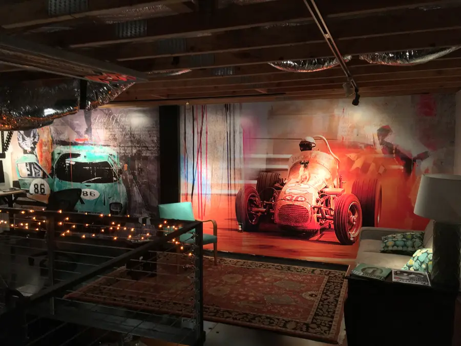 Colorful automotive wall graphics in a restaurant dining area